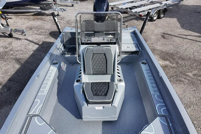 Slide: The Image of 2026 Xpress H22B Bay boat interior with modern seating and measurement markings. - 9