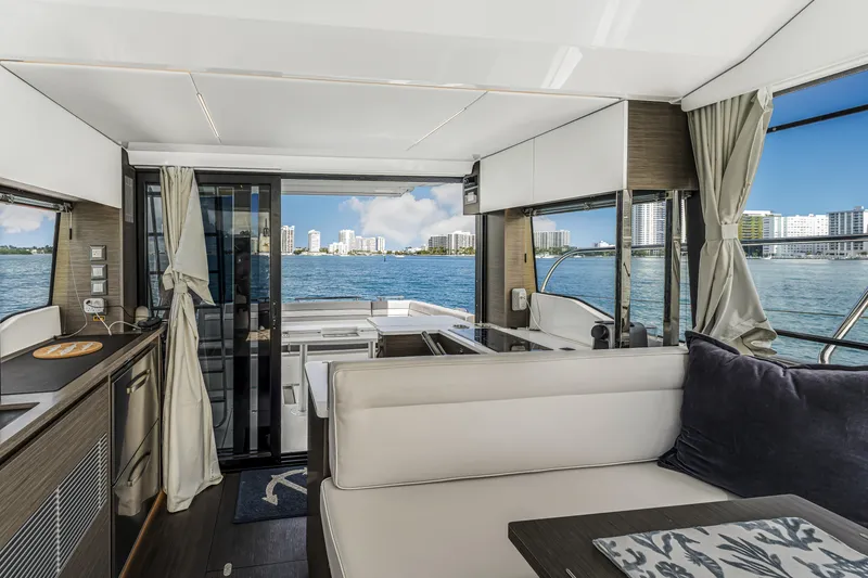 Slide: The Image of Interior of 2025 Jeanneau NC 1295 Fly yacht with waterfront view. - 23