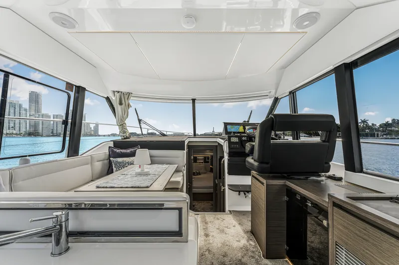 Slide: The Image of Interior of 2025 Jeanneau NC 1295 Fly yacht with modern helm and seating area. - 25