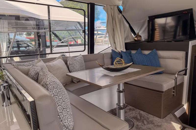 Slide: The Image of 2025 Jeanneau NC 1295 Fly yacht on clear turquoise water, aerial view. - 3