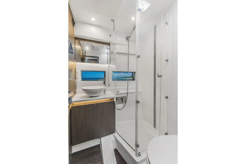 Slide: The Image of Modern bathroom interior of 2025 Jeanneau NC 1295 Fly yacht, featuring sleek design and glass shower. - 33