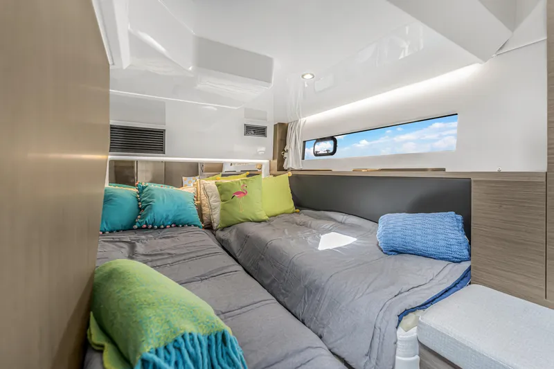 Slide: The Image of Interior cabin of 2025 Jeanneau NC 1295 Fly with cozy bedding and window view. - 35
