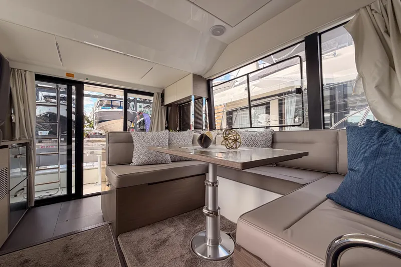 Slide: The Image of Modern kitchen interior on 2025 Jeanneau NC 1295 Fly yacht with cityscape view. - 9