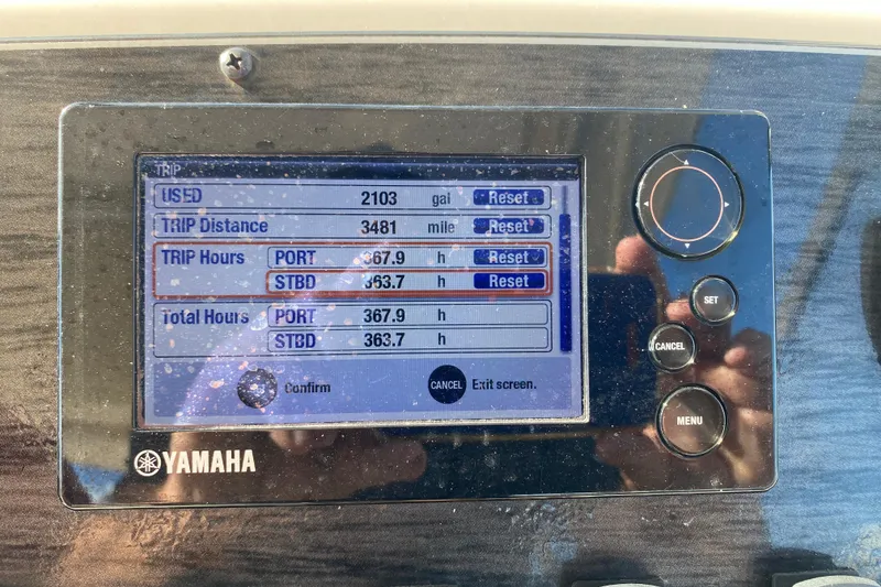 Slide: The Image of Dashboard of 2015 Grady-White Freedom 285 boat with navigation and communication equipment. - 11