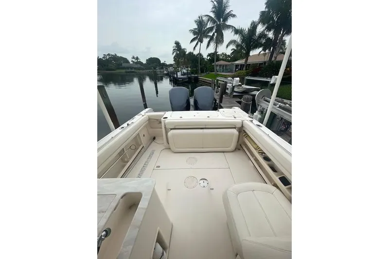 Slide: The Image of 2015 Grady-White Freedom 285 boat interior with storage drawers and seating. - 17