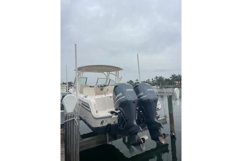 Slide: The Image of 2015 Grady-White Freedom 285 boat with open storage compartments at dock. - 20