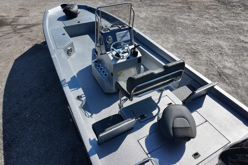 Slide: The Image of 2026 Xpress H24B Bay boat interior with steering console and seating. - 15