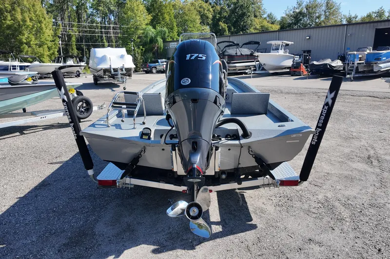 Slide: The Image of 2026 Xpress H24B Bay boat with 175 HP engine in a dealership lot. - 16