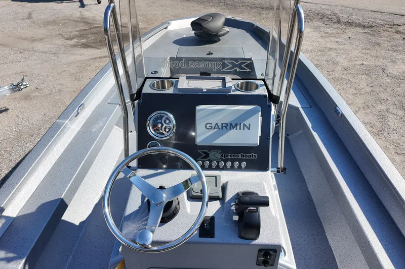 Slide: The Image of 2026 Xpress H24B Bay boat dashboard with Garmin navigation system. - 18