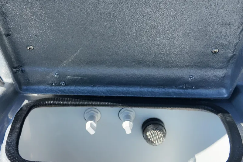 Slide: The Image of Interior view of 2026 Xpress H24B Bay boat compartment with controls and fittings. - 20