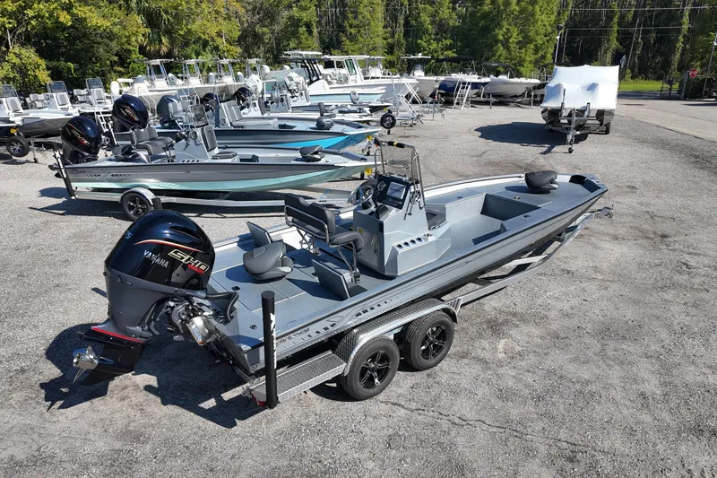 Slide: The Image of 2026 Xpress H24B Bay boat with Yamaha engine in a dealership lot. - 3