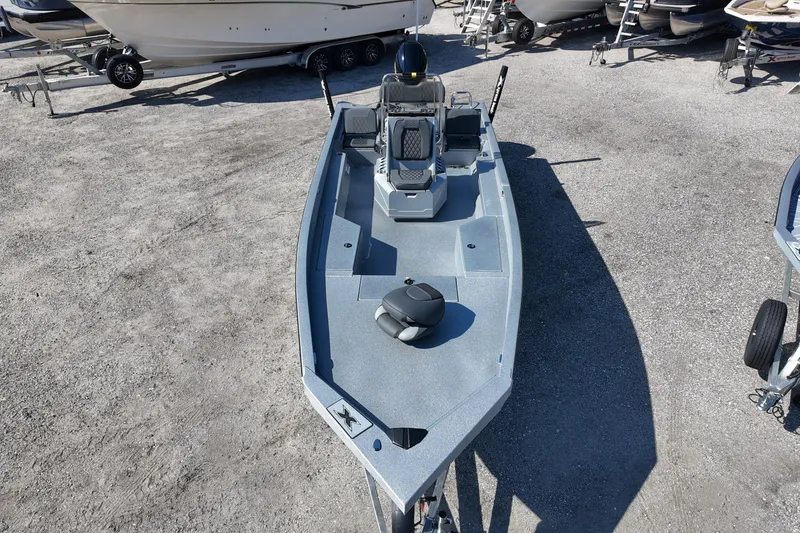 Slide: The Image of 2026 Xpress H24B Bay boat on display in a marina setting. - 6