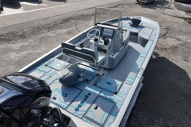 Slide: The Image of 2026 Xpress X23B Bay Lounge boat with Yamaha engine, featuring modern design and seating. - 11