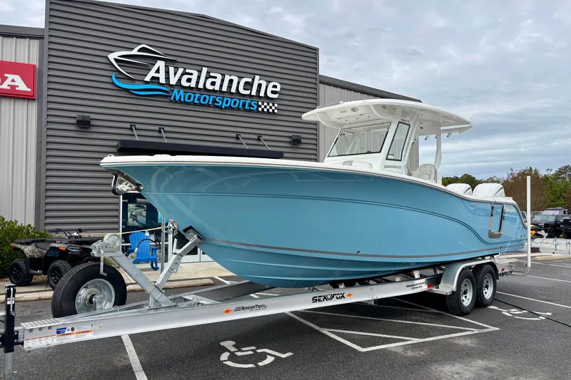 The Image of 2026 Sea Fox 288 Commander boat on trailer at Avalanche Motorsports dealership. - 0
