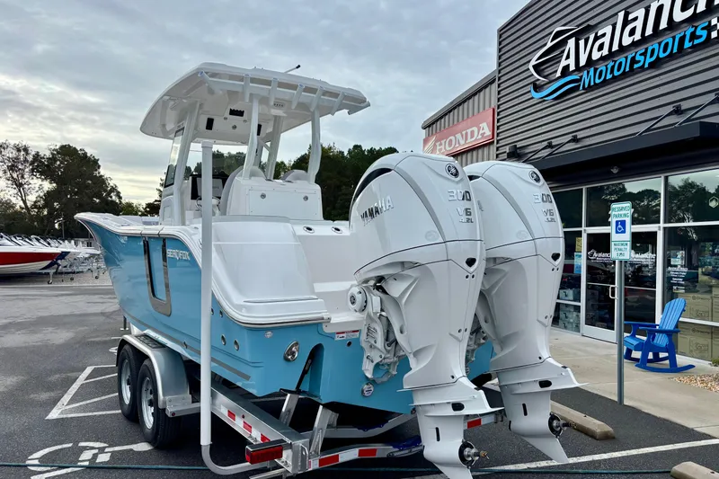 Slide: The Image of 2026 Sea Fox 288 Commander boat with dual Yamaha engines at dealership. - 18