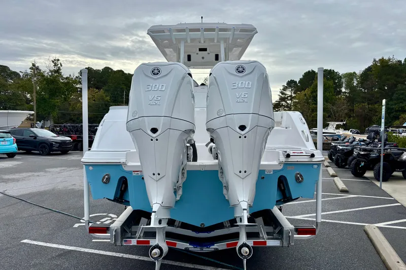 Slide: The Image of 2026 Sea Fox 288 Commander with twin Yamaha 300 V6 engines, parked outdoors. - 19