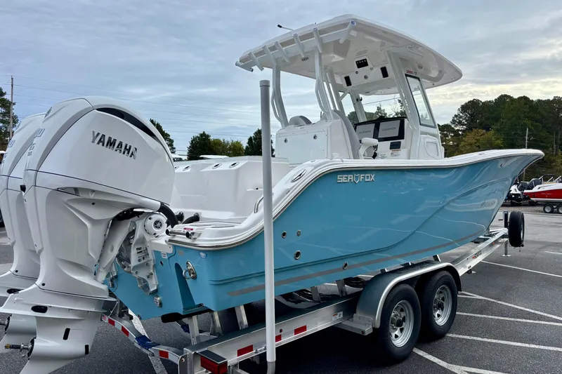 Slide: The Image of 2026 Sea Fox 288 Commander boat with Yamaha engines on a trailer. - 2