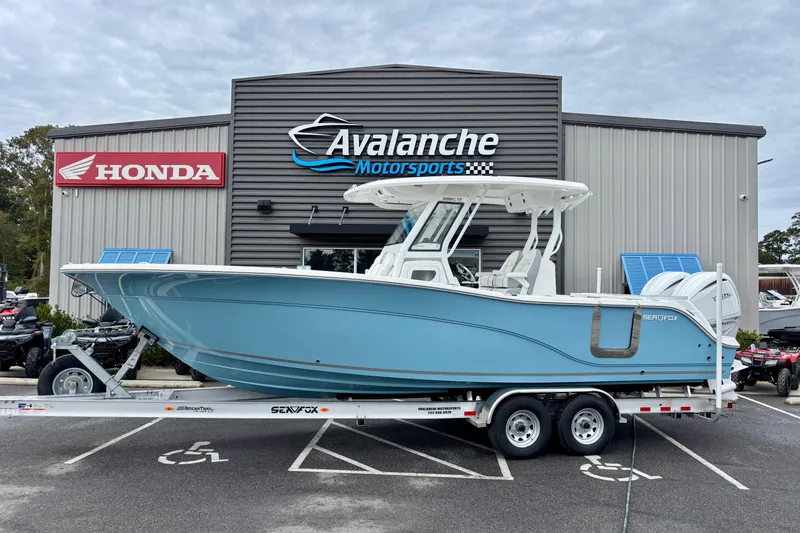 Slide: The Image of 2026 Sea Fox 288 Commander boat on trailer at Avalanche Motorsports dealership. - 4