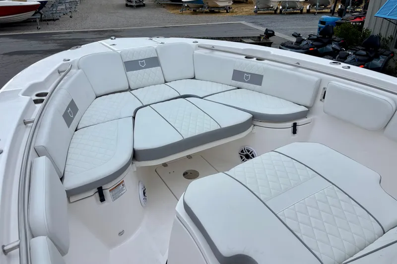 Slide: The Image of 2026 Sea Fox 288 Commander boat with luxurious white seating and quilted upholstery. - 9