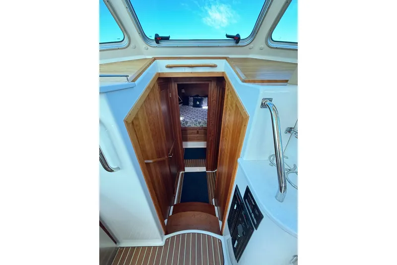 Slide: The Image of Interior view of 2020 Back Cove 37 yacht, featuring wooden cabinetry and skylight. - 31