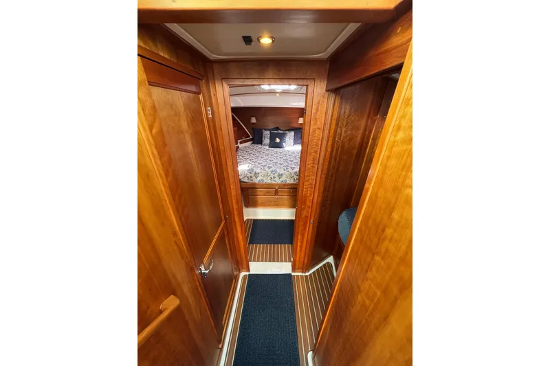 Slide: The Image of 2020 Back Cove 37 yacht interior with wooden finish and cozy bedroom. - 32
