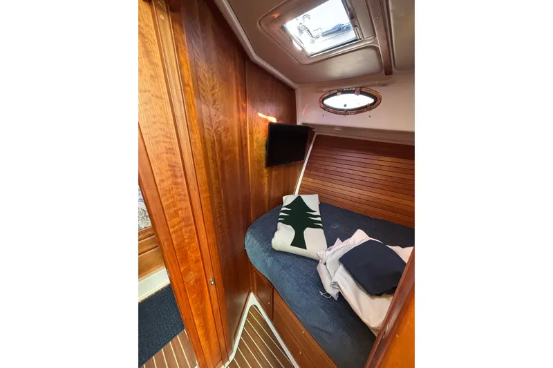 Slide: The Image of Cozy cabin interior of 2020 Back Cove 37 yacht with wood paneling and bedding. - 33