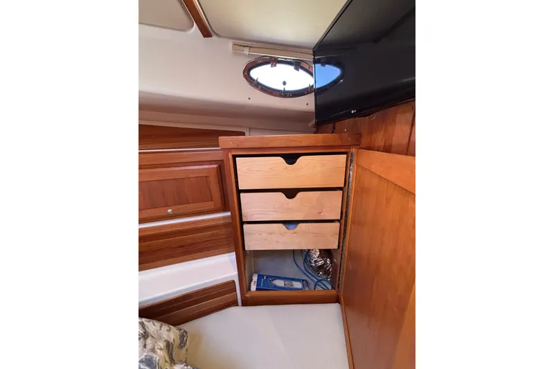 Slide: The Image of Interior of 2020 Back Cove 37 yacht with wooden drawers and porthole window. - 40