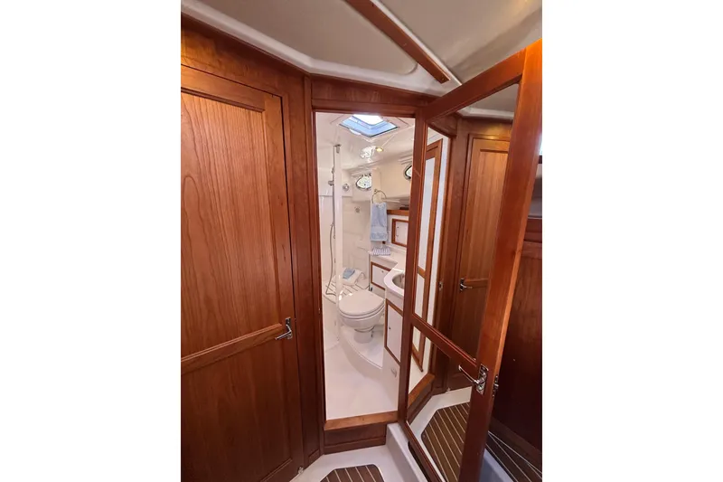Slide: The Image of Luxurious bathroom interior of 2020 Back Cove 37 yacht with wooden cabinetry and modern fixtures. - 44