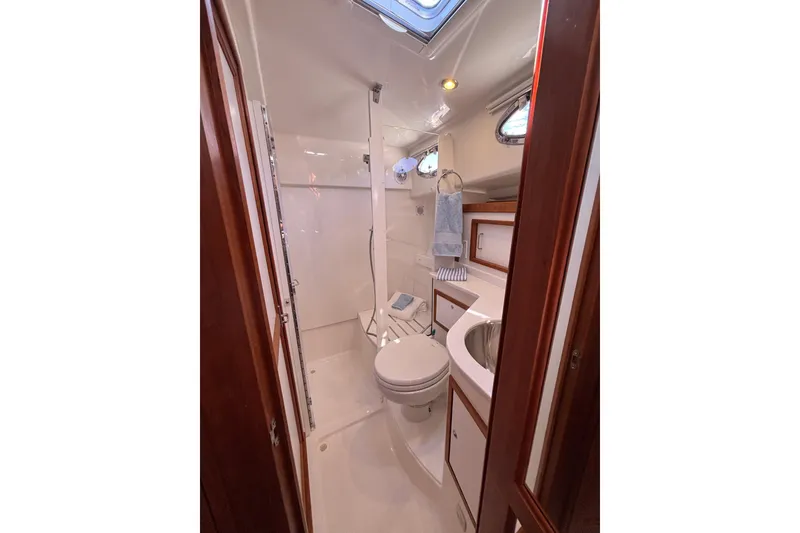 Slide: The Image of 2020 Back Cove 37 yacht bathroom with shower, sink, and toilet. - 45