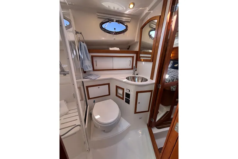 Slide: The Image of Luxurious 2020 Back Cove 37 yacht bathroom with modern fixtures and elegant wood accents. - 46