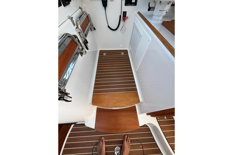 Slide: The Image of 2020 Back Cove 37 boat interior with wooden flooring and stainless steel fixtures. - 50