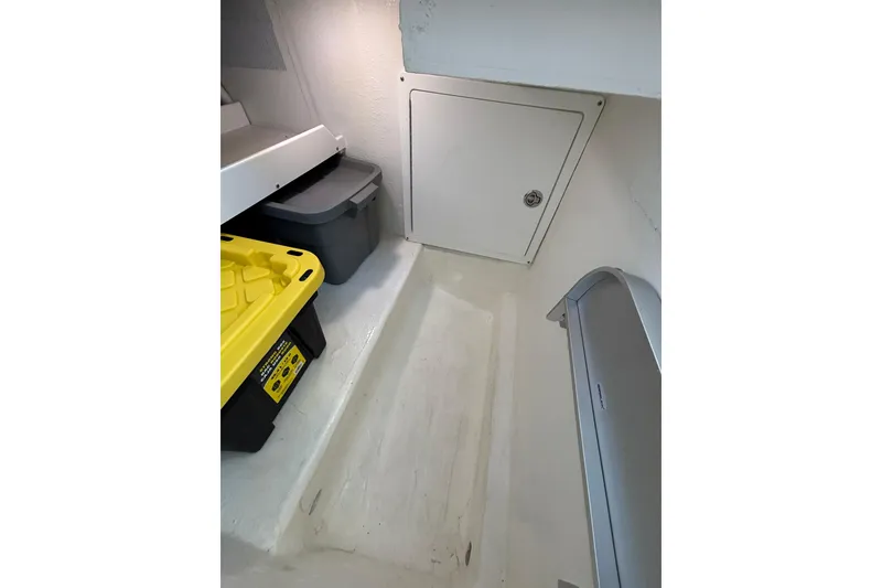 Slide: The Image of Storage area in 2020 Back Cove 37 boat with bins and access panel. - 52