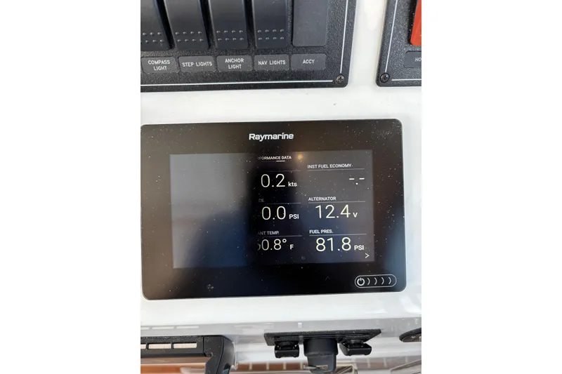 Slide: The Image of Raymarine display on 2020 Back Cove 37 showing performance data and fuel pressure. - 54