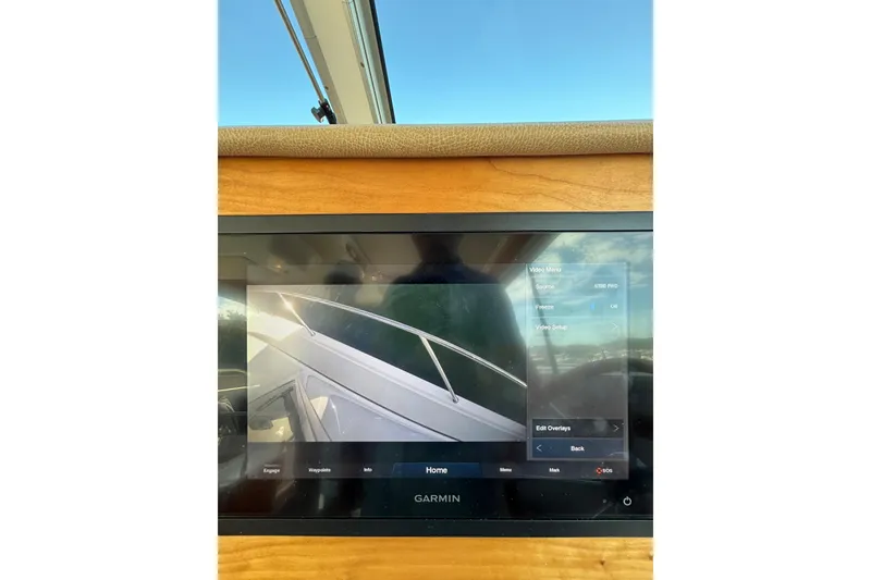 Slide: The Image of Garmin display on 2020 Back Cove 37 boat, showing video feed and menu options. - 59