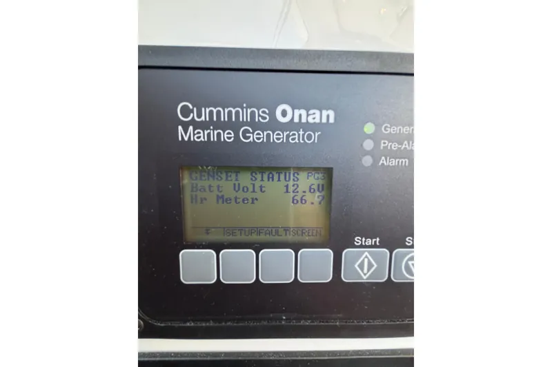 Slide: The Image of Cummins Onan marine generator display on 2020 Back Cove 37 boat, showing battery voltage. - 64