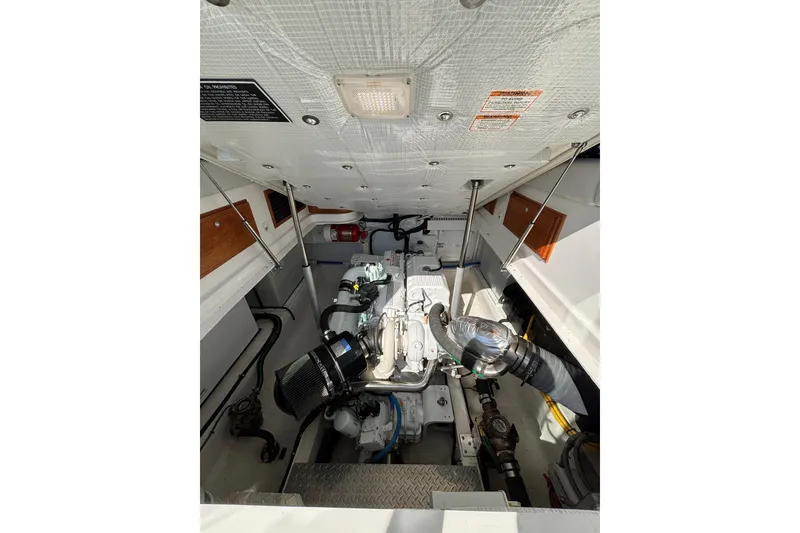 Slide: The Image of Engine compartment of 2020 Back Cove 37 boat, showcasing mechanical components. - 68