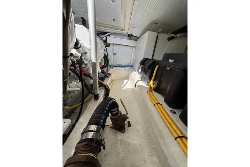 Slide: The Image of Engine room of 2020 Back Cove 37 boat, showcasing mechanical components and wiring. - 72