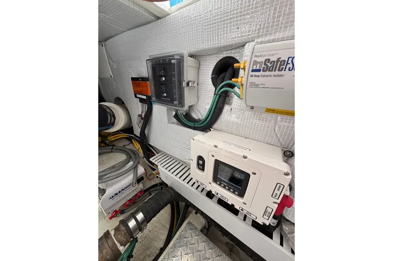 Slide: The Image of Engine room of 2020 Back Cove 37 with electrical components and wiring. - 73