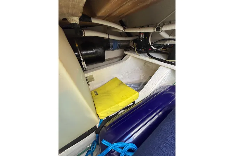 Slide: The Image of Engine compartment of 2020 Back Cove 37 boat with hoses and equipment. - 76