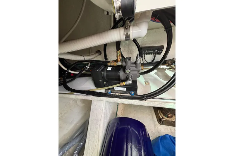 Slide: The Image of Engine compartment of 2020 Back Cove 37 boat, showcasing mechanical components and wiring. - 77