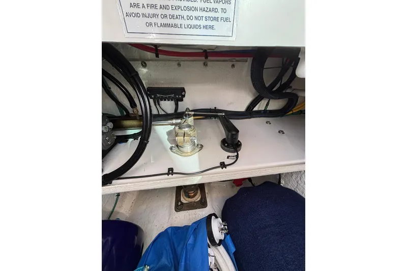 Slide: The Image of Engine compartment of 2020 Back Cove 37 boat, showing wiring and fuel components. - 78