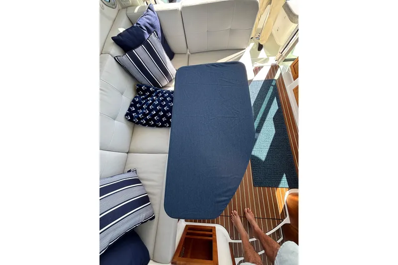 Slide: The Image of Cozy seating area on 2020 Back Cove 37 yacht with nautical-themed cushions. - 79