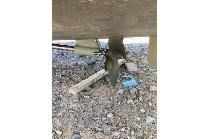 Slide: The Image of Propeller of 2020 Back Cove 37 boat on rocky ground. - 81