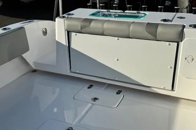 Slide: The Image of 2026 Cape Horn 34 XS boat interior with cushioned seating and storage compartments. - 10