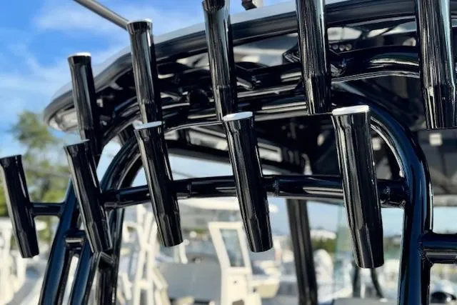 Slide: The Image of 2026 Cape Horn 34 XS boat with sleek black rod holders and modern design. - 11