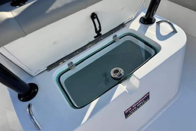 Slide: The Image of 2026 Cape Horn 34 XS boat livewell with open lid and secure latch. - 19