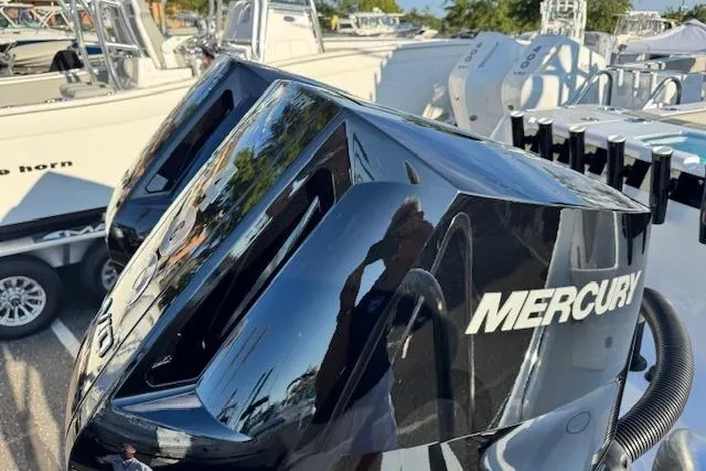 Slide: The Image of 2026 Cape Horn 34 XS boat with Mercury engines, docked in a marina. - 27