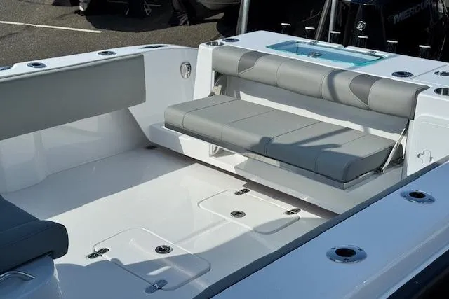 Slide: The Image of 2026 Cape Horn 34 XS boat interior with gray seating and storage compartments. - 5