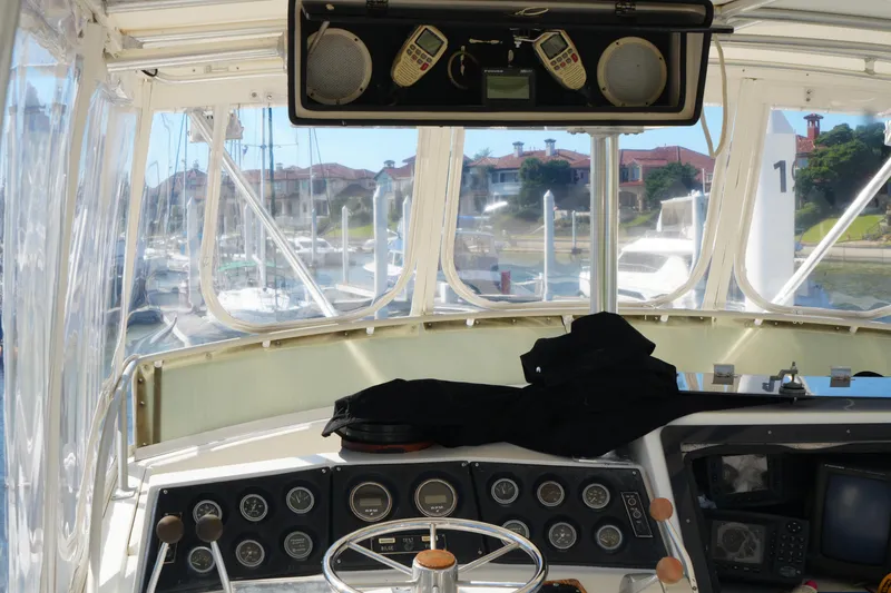Slide: The Image of Interior view of a 1977 Bertram 46.6 yacht cockpit with navigation instruments. - 10