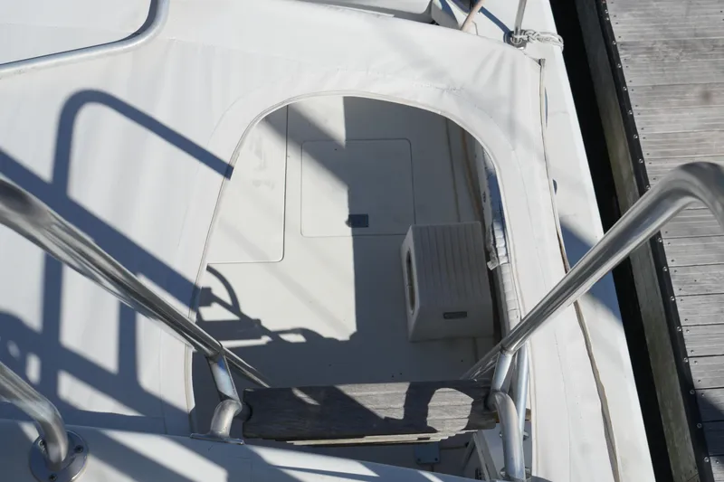 Slide: The Image of Staircase leading to the deck of a 1977 Bertram 46.6 yacht. - 16